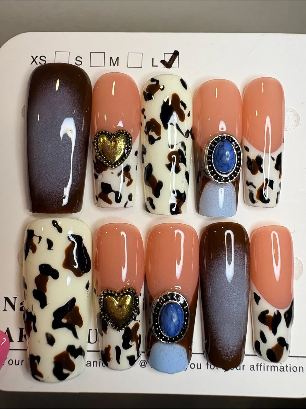 Peach & Cow Print Press-On Nails with Gold Heart and Blue Stone Accent